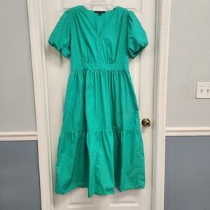 French Connection women's puff sleeve tiered maxi dress. It features a V-neck.